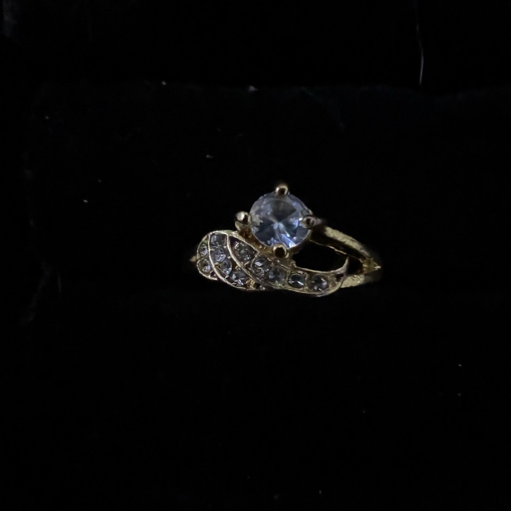 Elegant Gold Colored Ring with Clear Stone